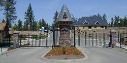 Ornamental Double Drive Gates With A Castle Theme